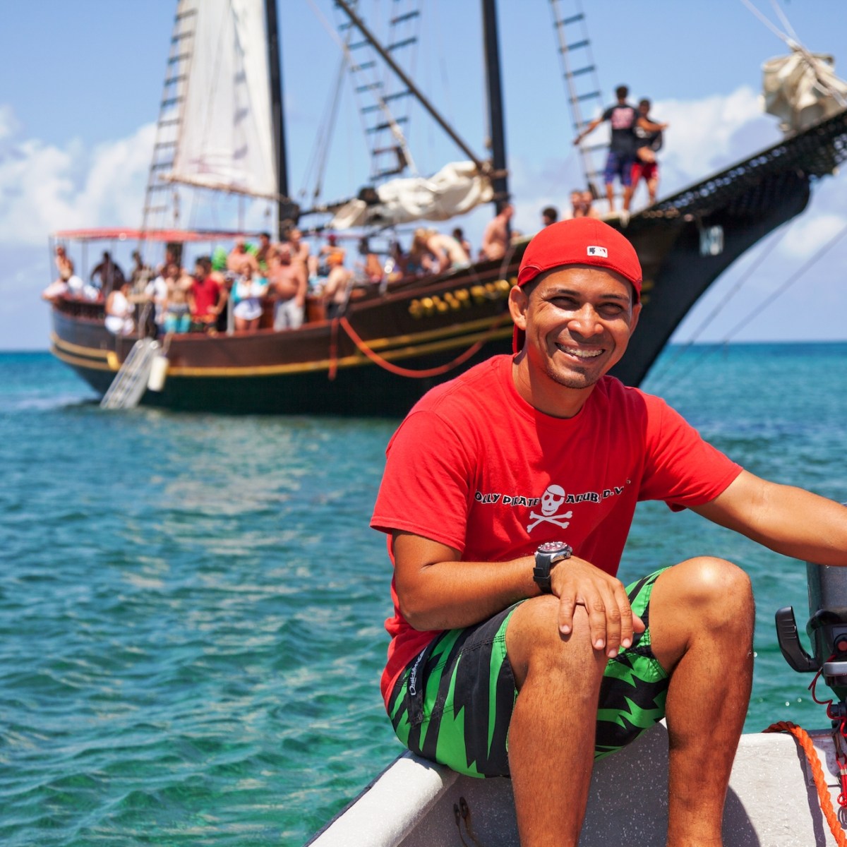 a man sitting in a boat on a body of water