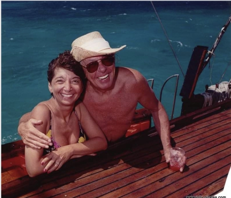 Screenshot_20210920-090033_Gallery a person sitting on top of a wooden boat in the water