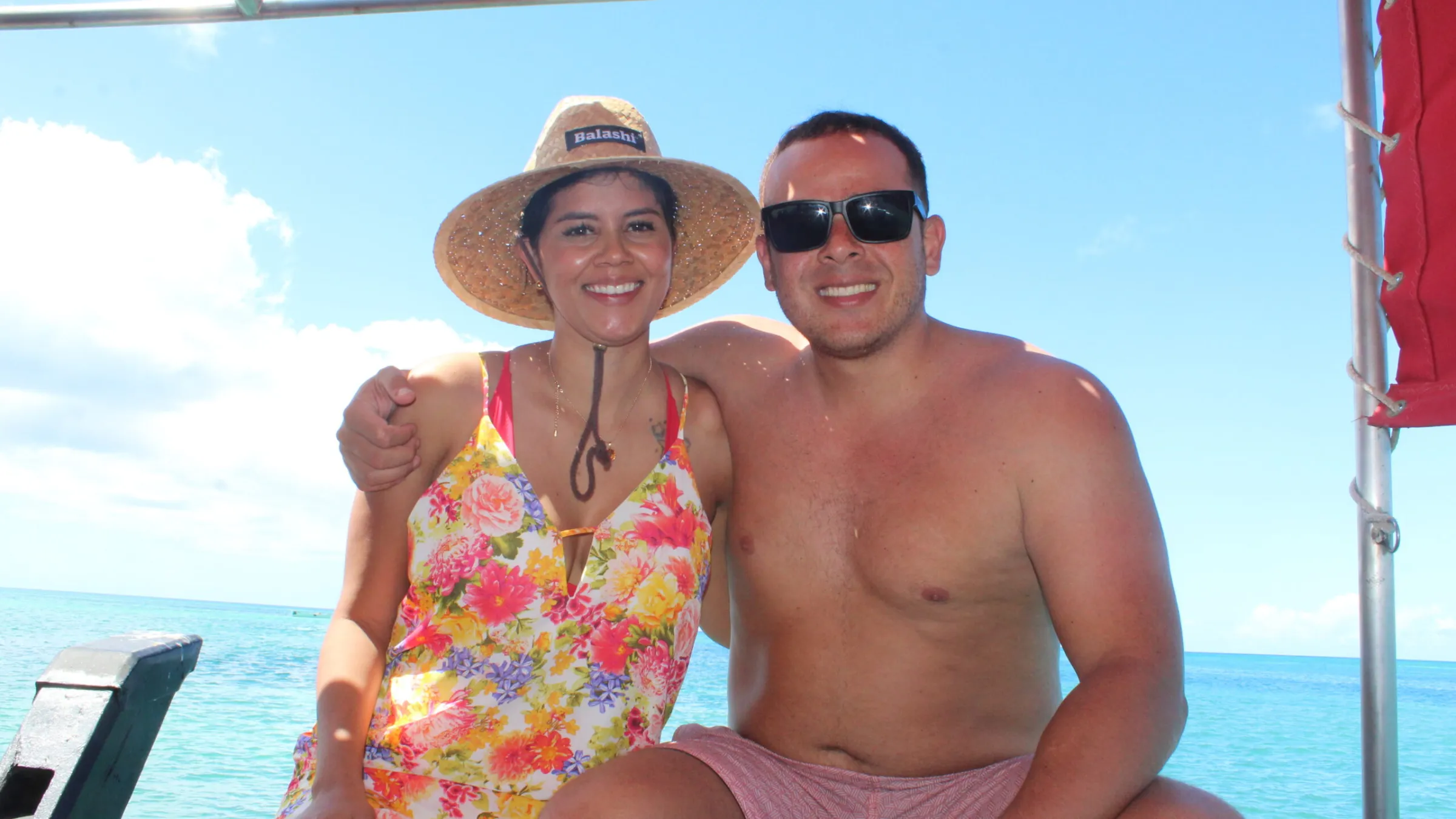 a man standing next to a body of water