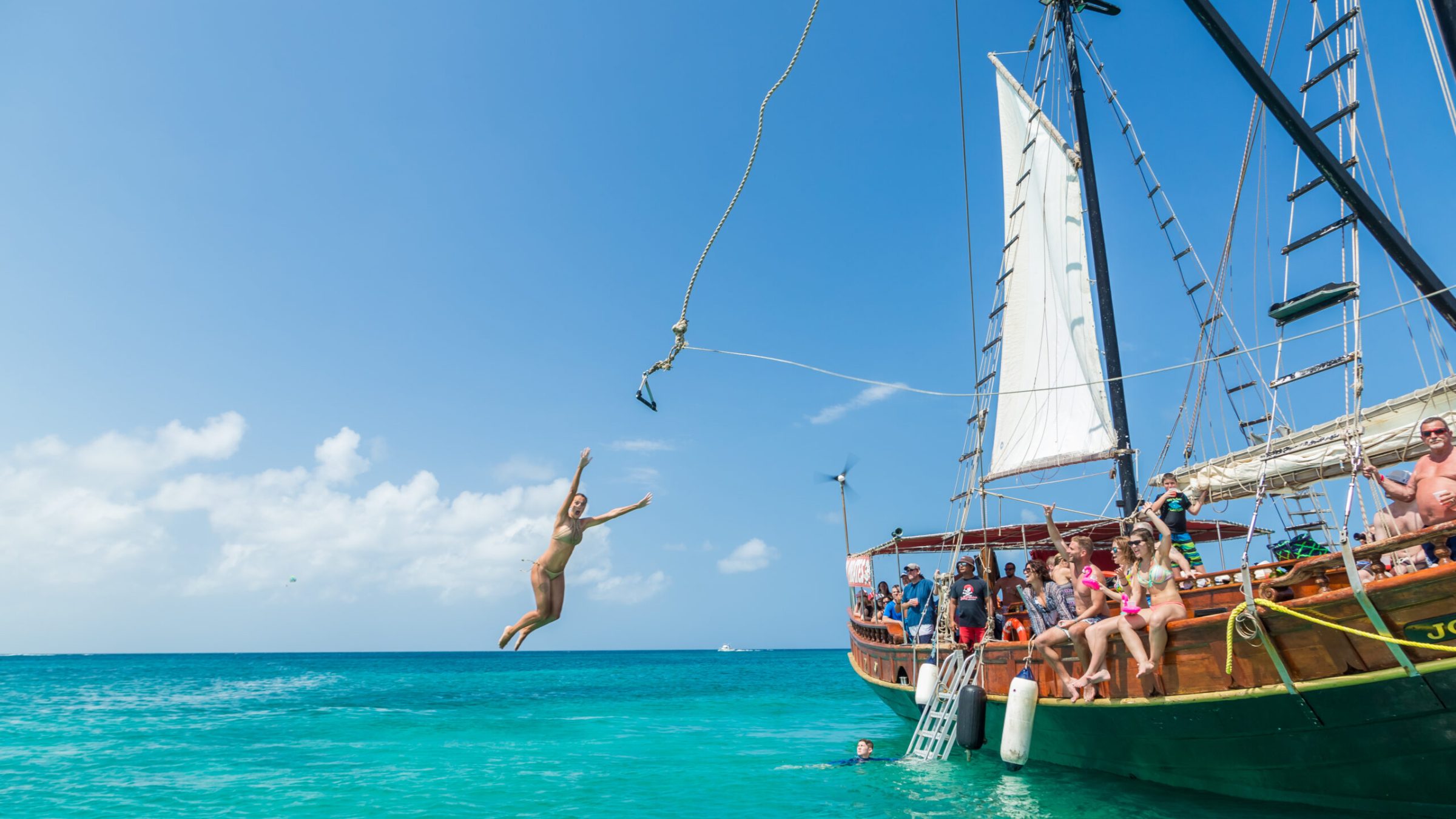 a group of people on a boat in the water