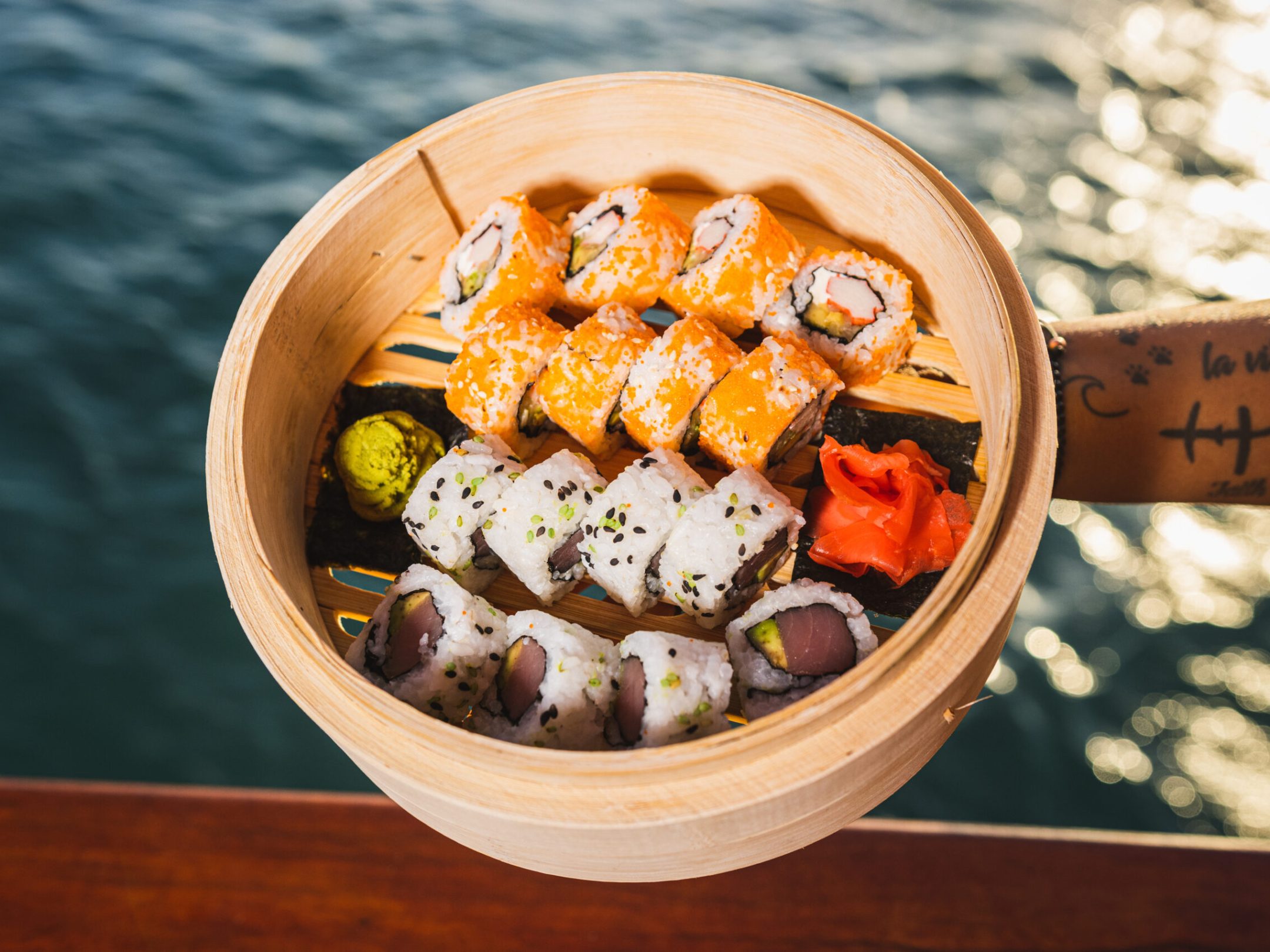 a bowl of food sitting on top of a wooden table