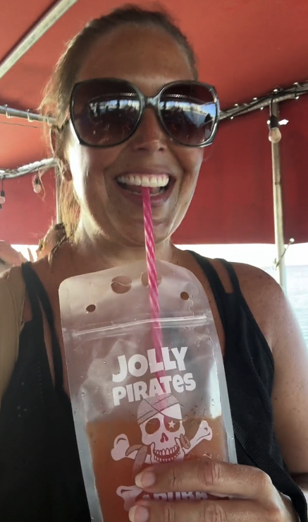 a woman wearing sunglasses taking a selfie