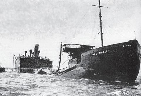 Black and white photo of a partially sunken ship named Pedernales in the sea.